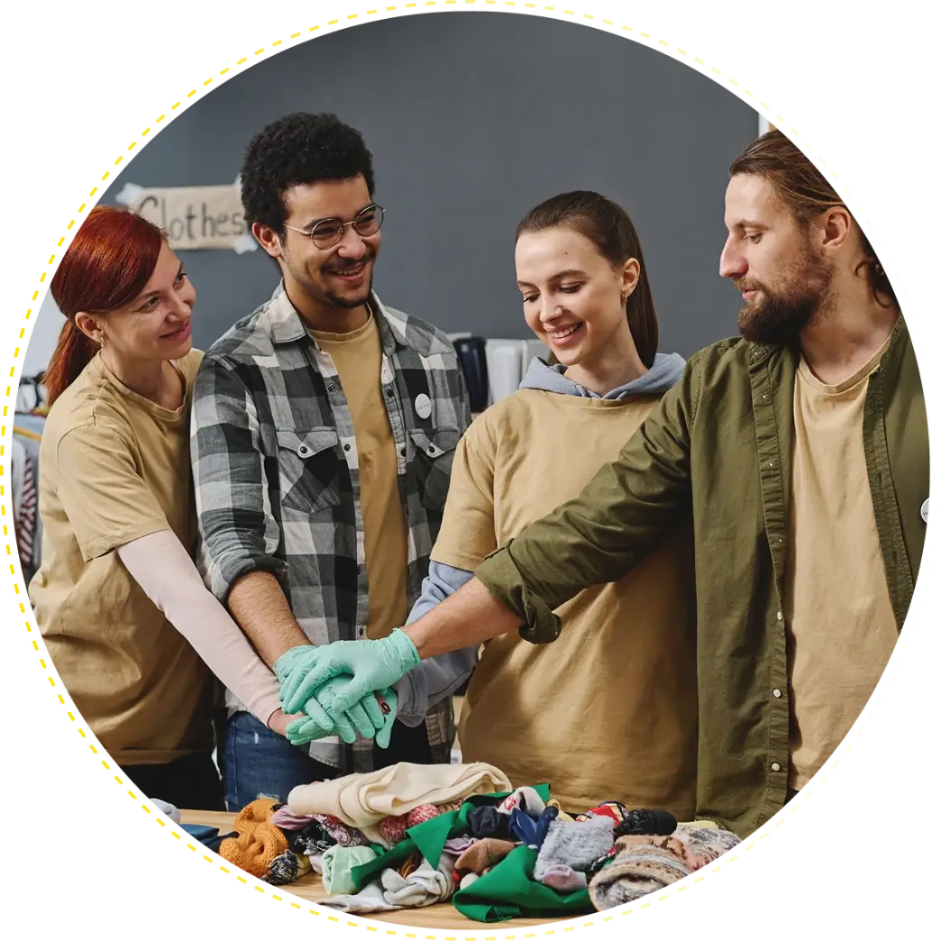 Group teamwork at a clothing donation center.